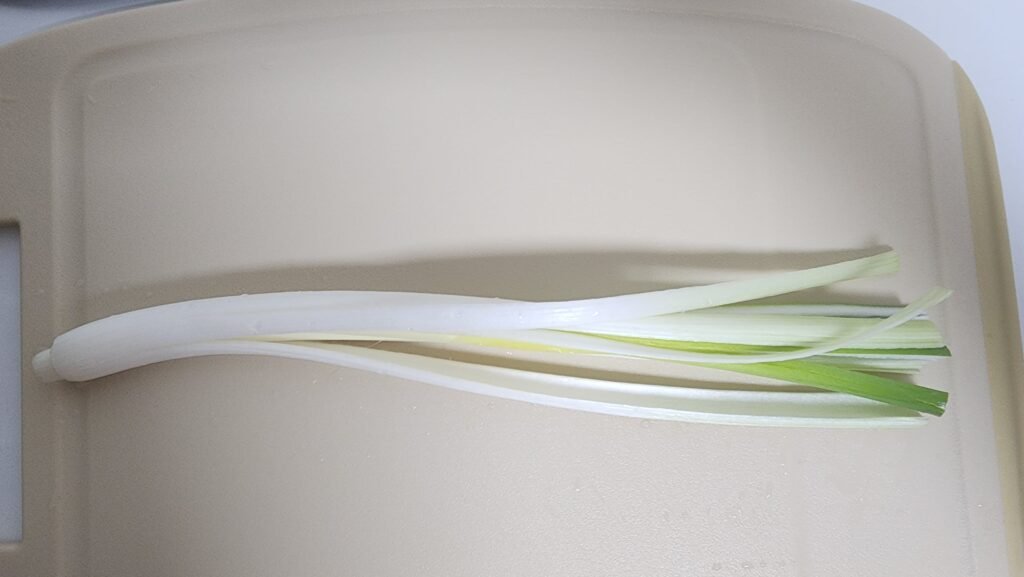Finely chopped scallion, onion, and carrot for tteokgalbi.