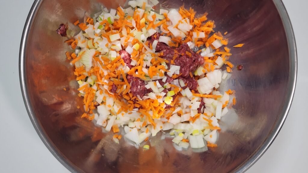 Shaping the beef and vegetable mixture into tteokgalbi patties.