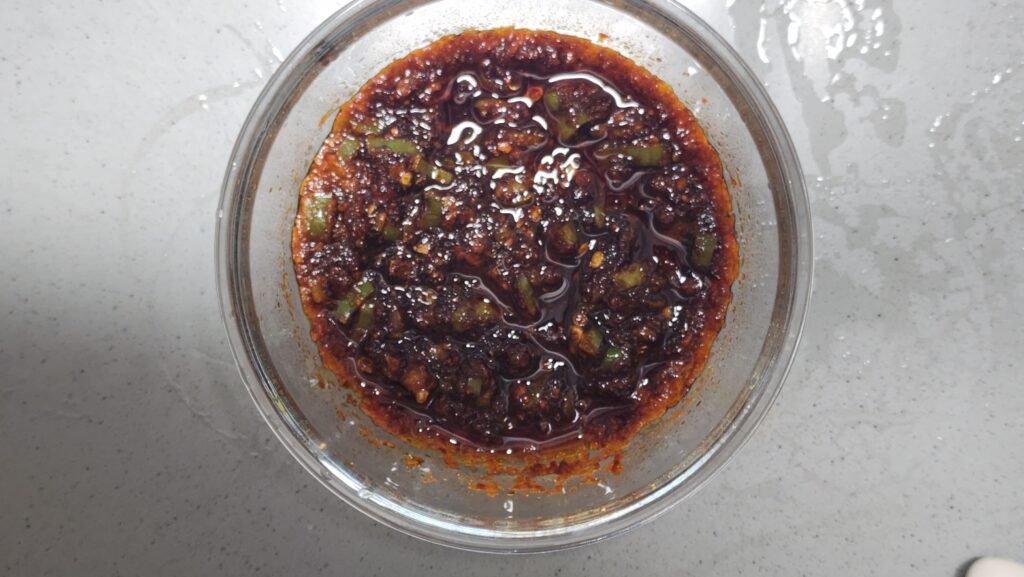 Freshly heated Korean chili oil infused in the microwave for 90 seconds