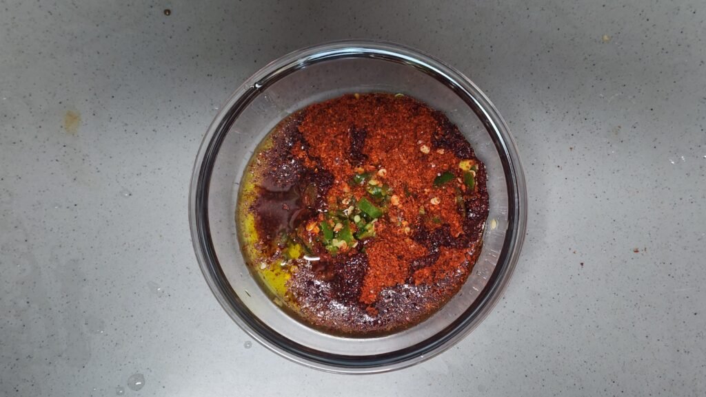Freshly heated Korean chili oil infused in the microwave for 90 seconds